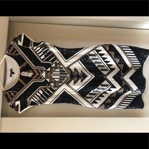 Sequin bodycon dress with cap sleeves.